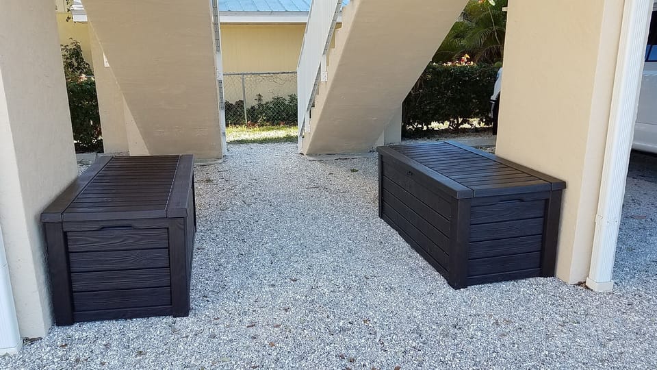 Storage with beach chairs, noodles, and cooler