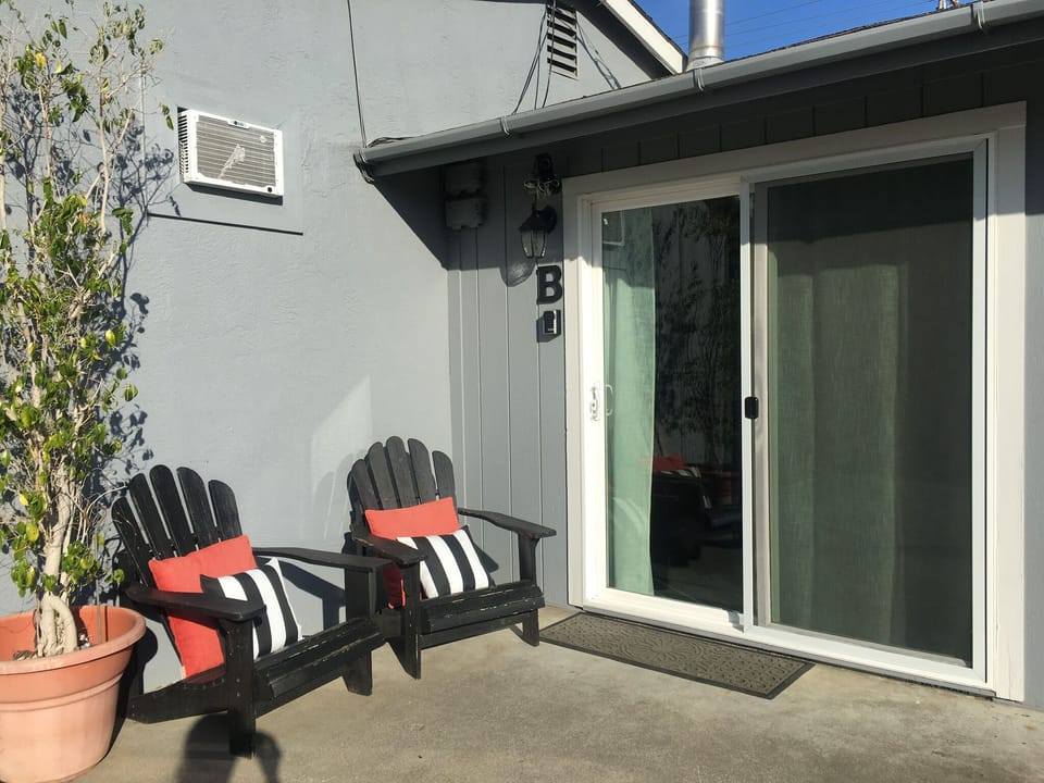 Enjoy a cup of coffee or glass of wine and watch the neighborhood go by