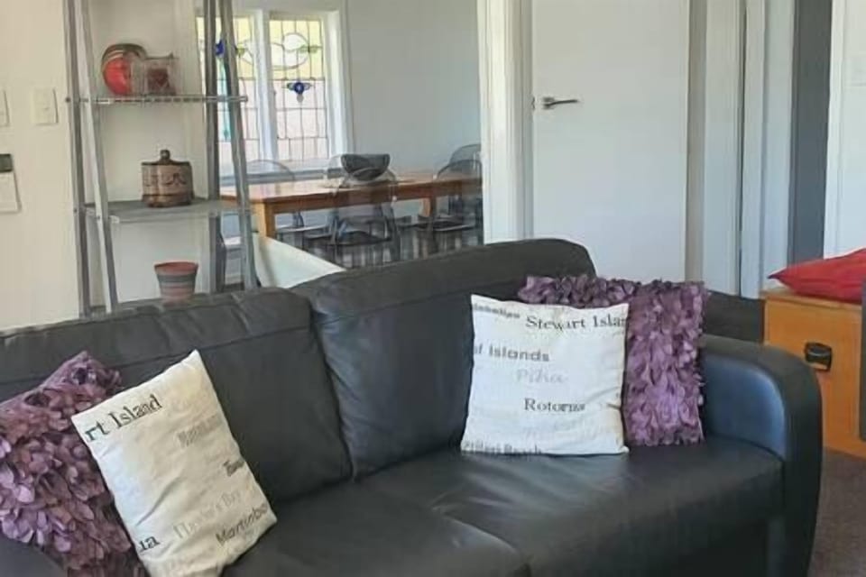 Looking from lounge to dining area. Leather couch offers a comfy pullout bed.