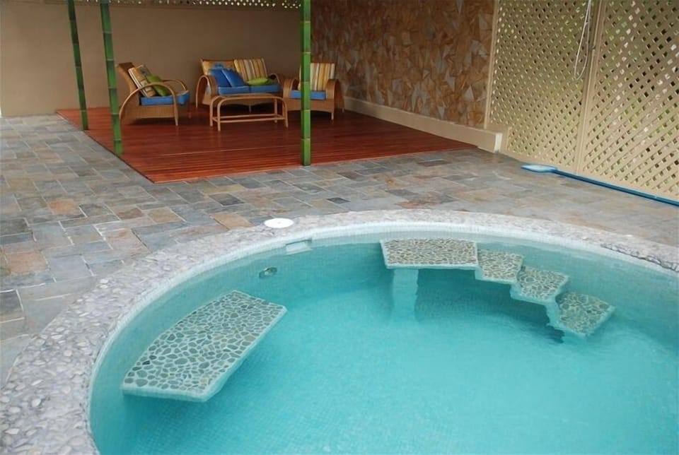 Covered Patio & Pool for you to enjoy plus outside shower to remove any sand too