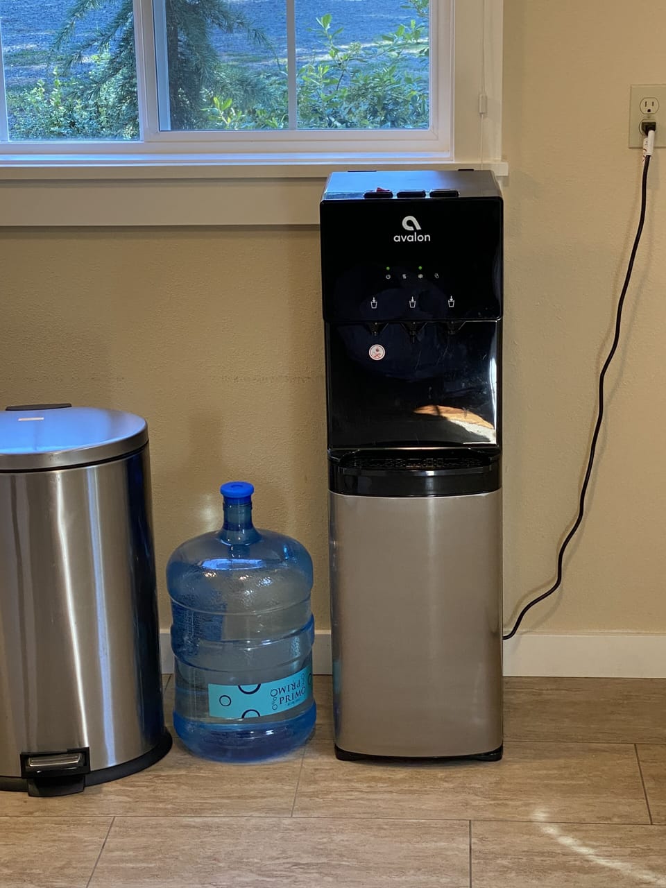 Purified water dispenser off kitchen with extra five gallon container if needed.