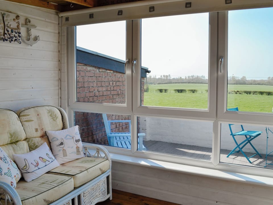 Relaxing sun room | Honeysuckle Cottage, Dreghorn, near Irvine