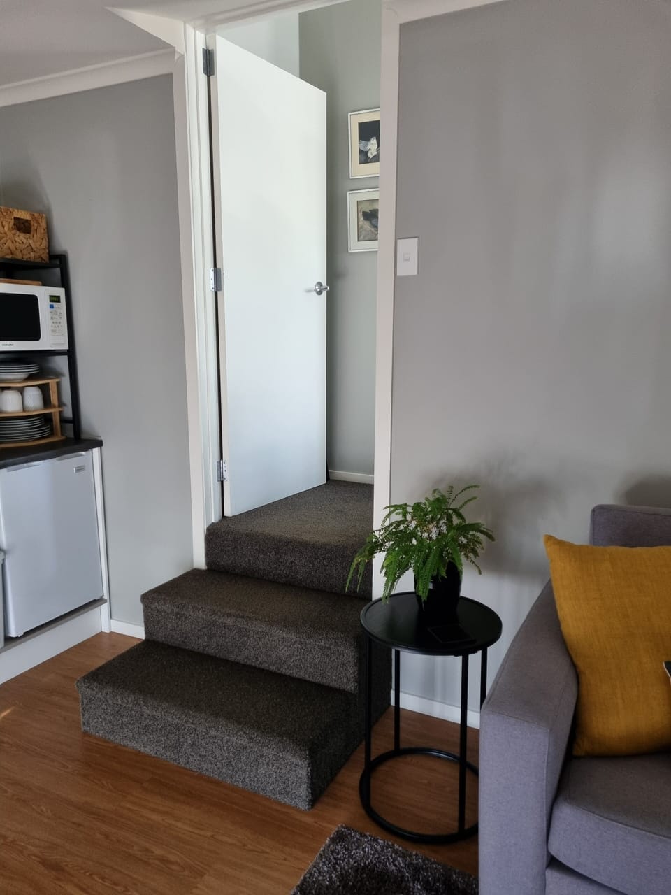 Three steps from living area up to bedroom and ensuite