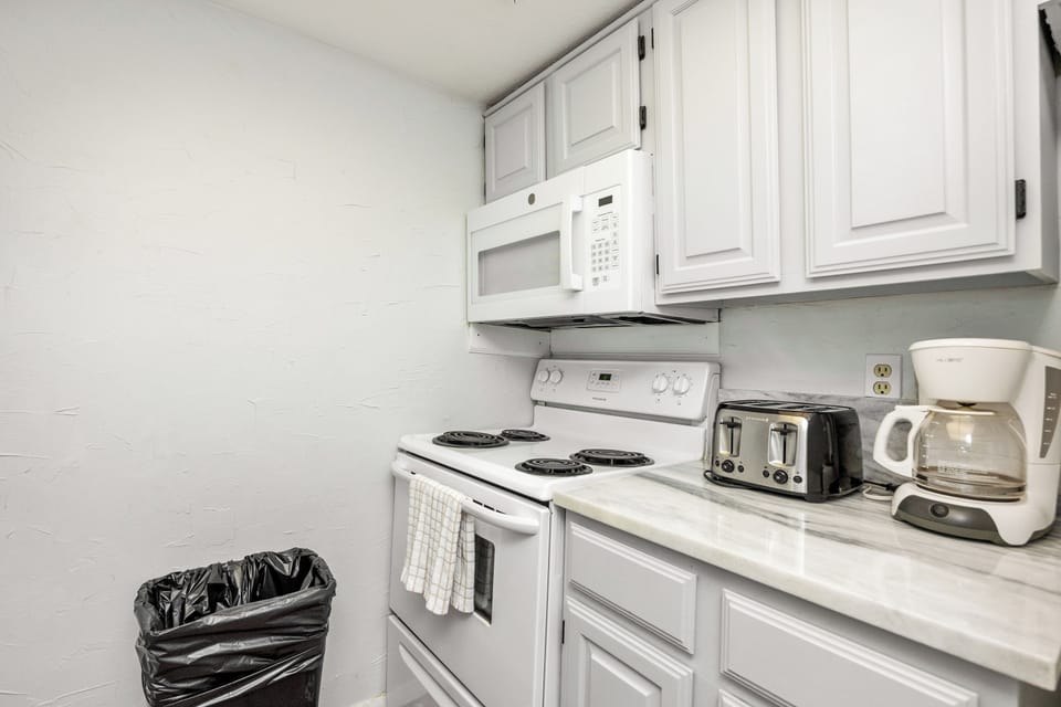 Your fully equipped kitchen features everything needed for home-cooked meals, from morning coffee to family dinners.