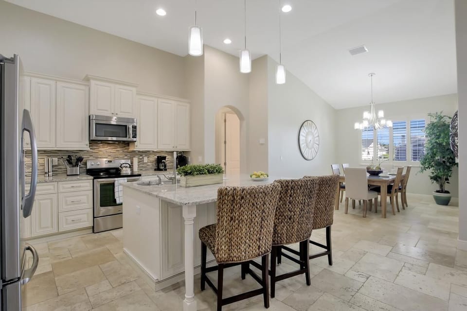The Kitchen is open plan with views over the Dining area and Living area