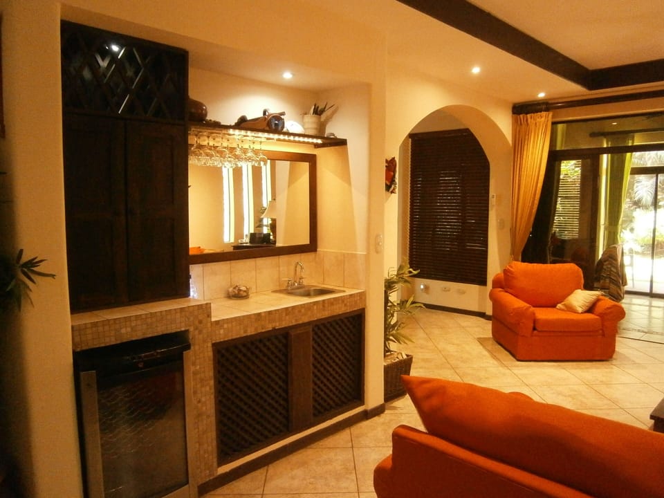 wine fridge, bar and sink
