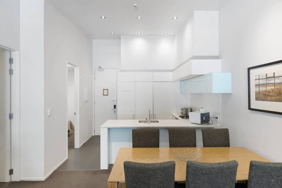 Entertainment lounge, with gas fireplace, open flow dining area, kitchen and private balcony.
