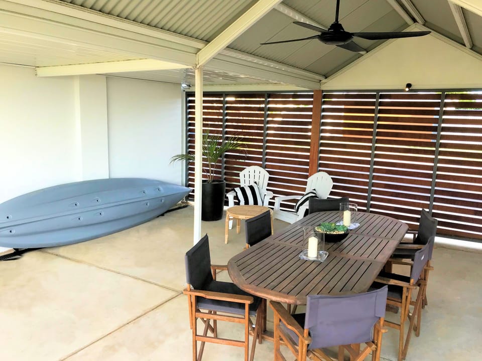 Covered outdoor dining area at The Admiral Riverside Studios