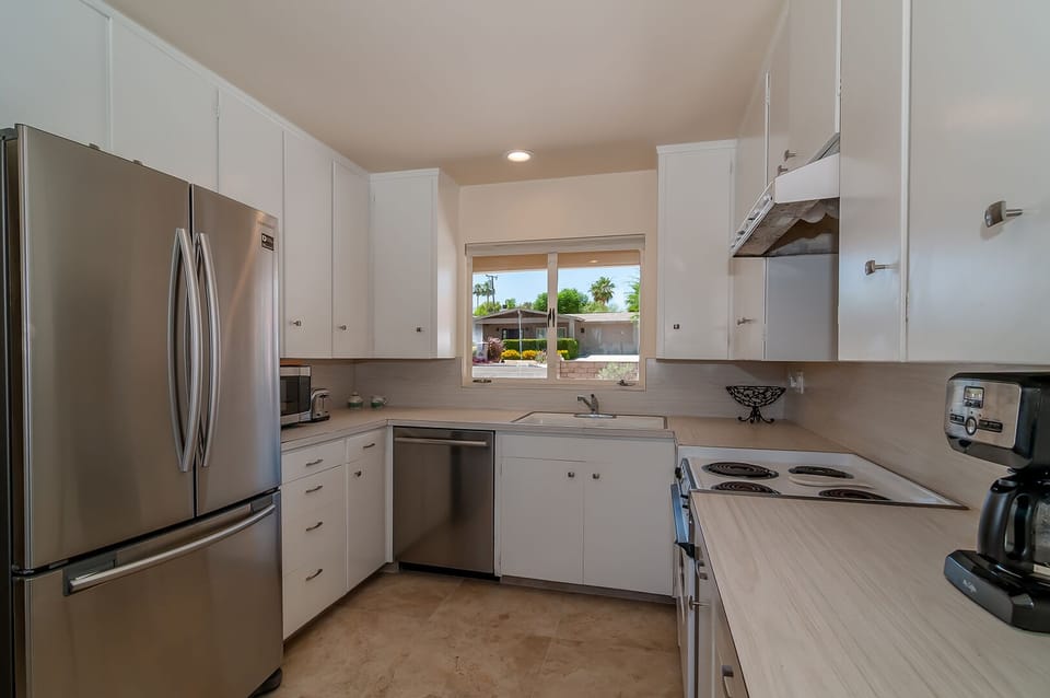 Kitchen with plenty of amenities. 