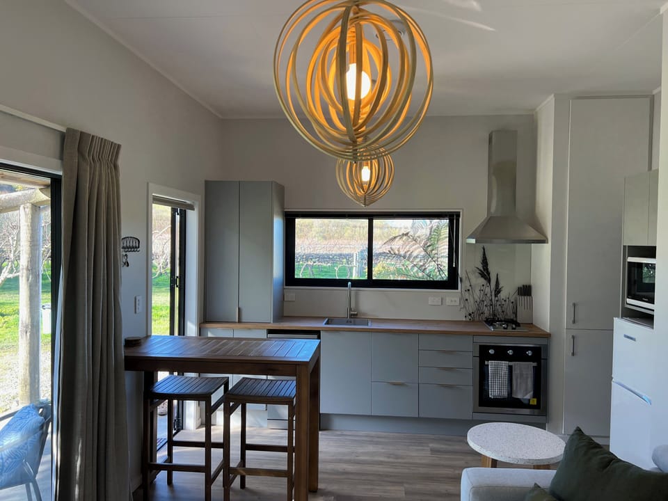 Kitchen with gas hob, electric oven, dishwasher, microwave, fridge - and a view!