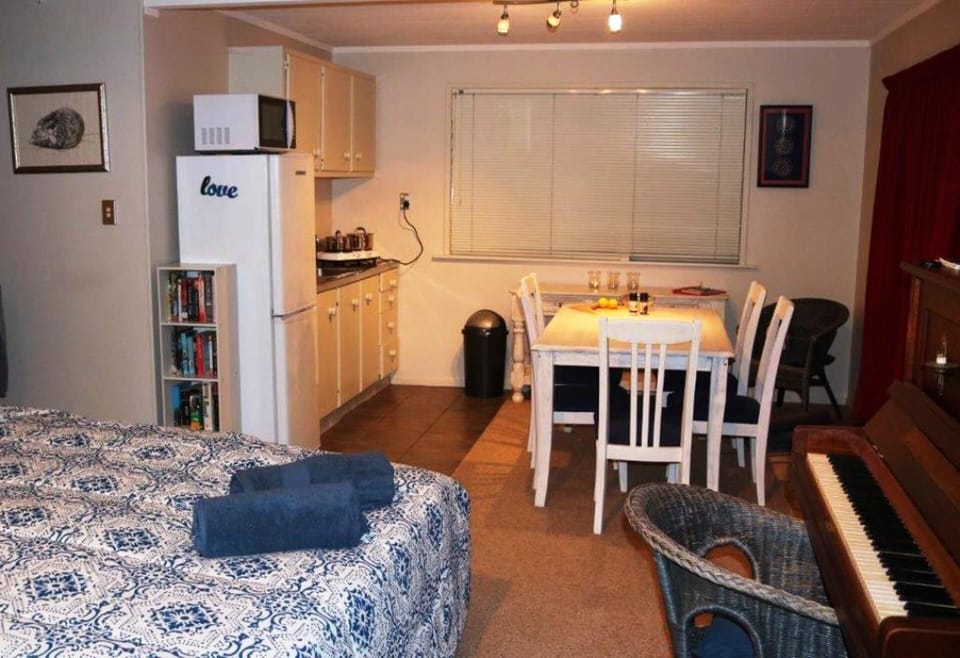 Dining and kitchenette with piano 