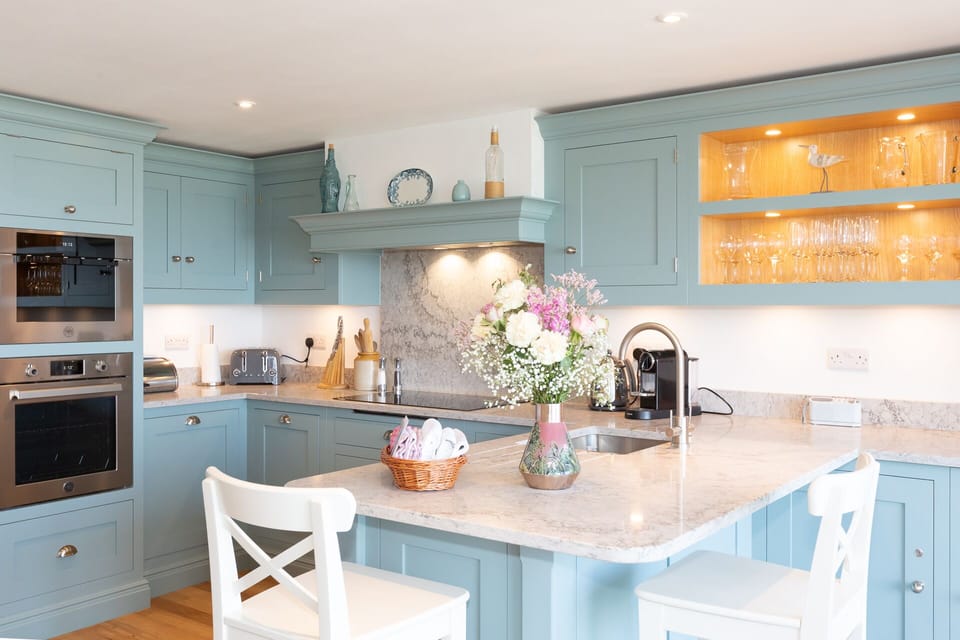 Dualit toaster, kettle and two ovens, one being a combi with built in micro wave