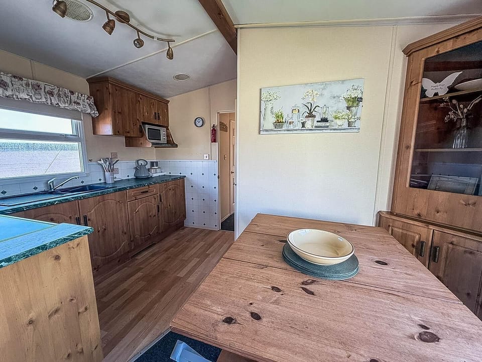 Cozy kitchen and dining area with rustic wooden charm