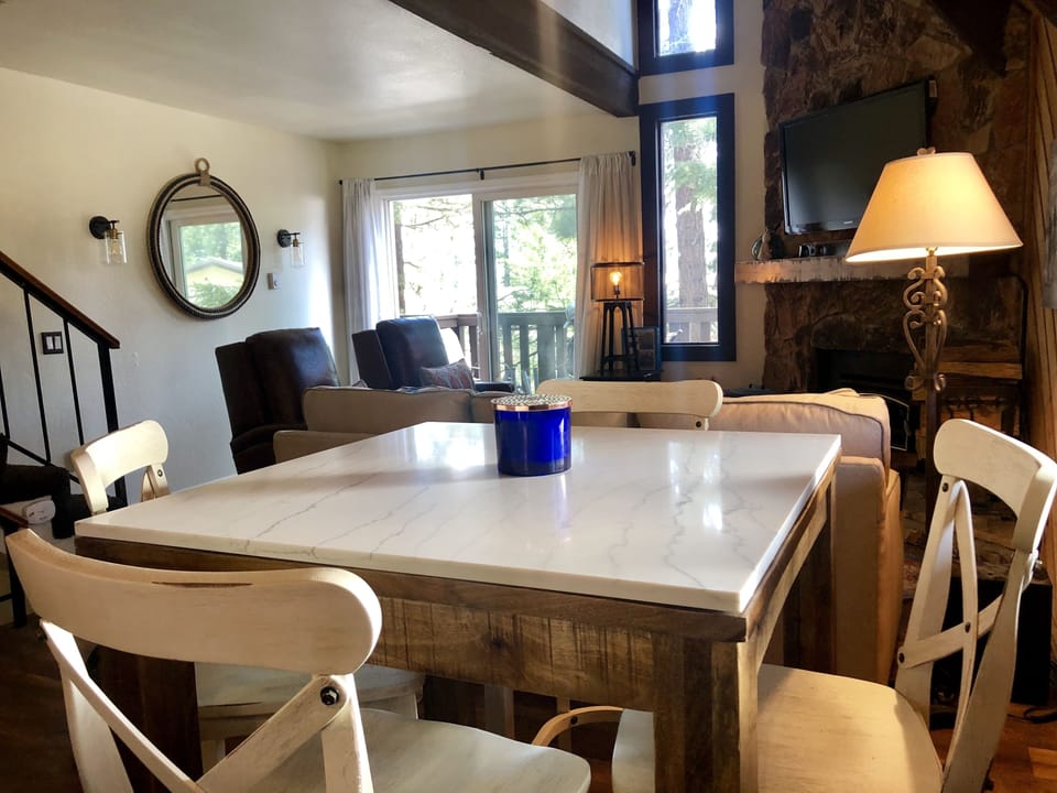 Marble top dining table overlooking the living room. Wonderful open concept