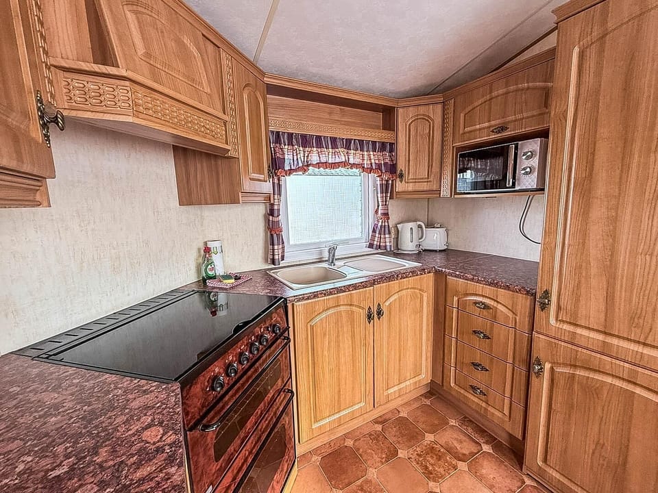 Compact yet equipped open caravan kitchen for all of your culinary needs