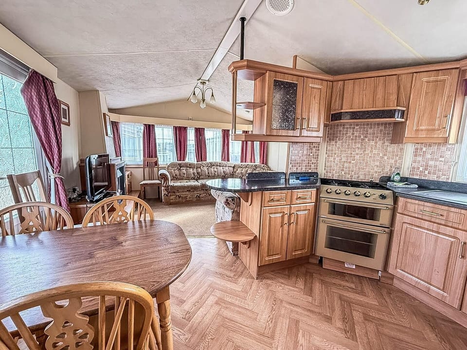 Prepare your favourite holiday meals while being part of the conversation in this convenient open plan caravan kitchen.