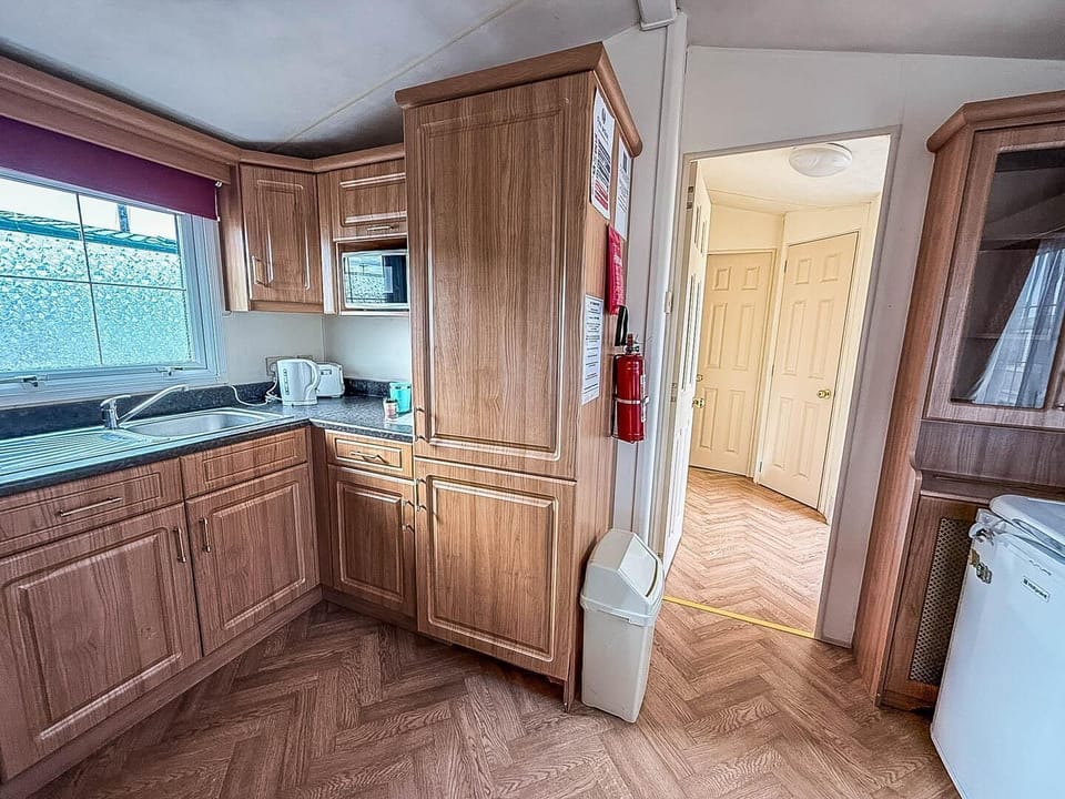 Compact yet equipped open caravan kitchen for all of your culinary needs