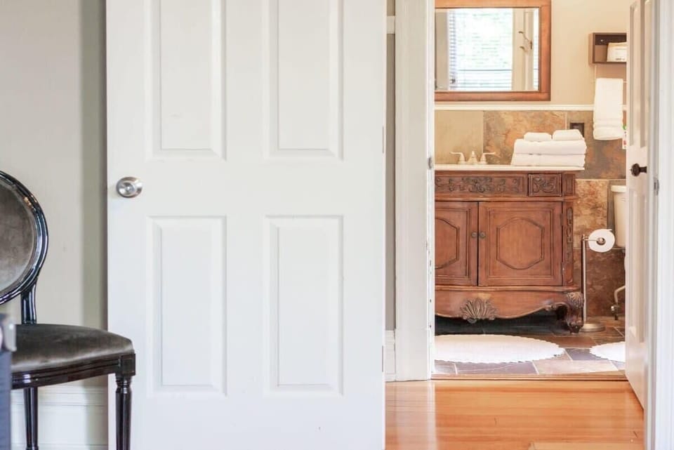 Convenient access from the hallway to the second floor bathroom, making it easy for guests staying upstairs. #GuestConvenience