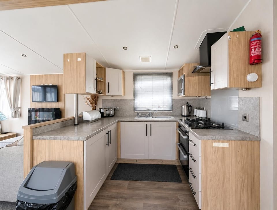 The holiday home dining area is perfect for hosting a family dinner or a quiet evening meal.
