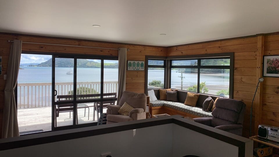 An open plan living area and kitchen looks out to the Whangārei harbour. 