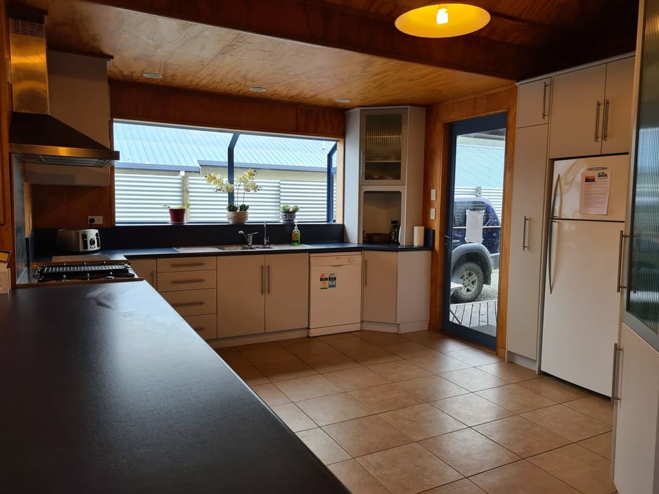Large open plan kitchen,dining and lounge with Breakfast Bar