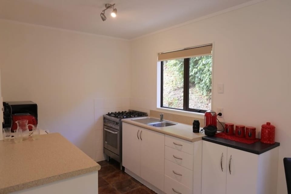 kitchen has fridge/microwave/electric oven and gas