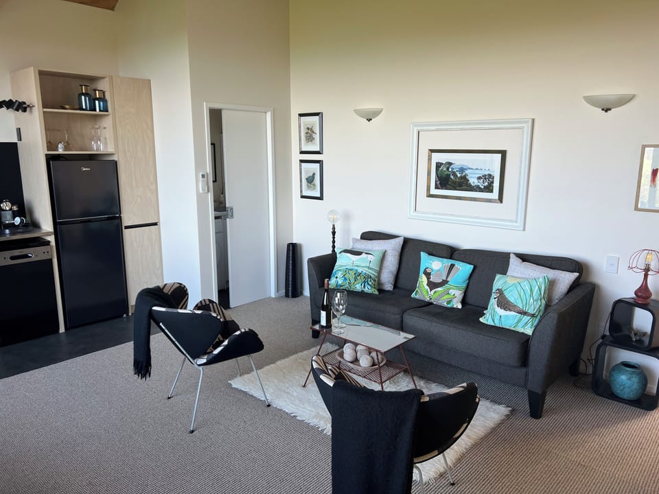 Living room showing through to kitchen and laundry (through sliding door)