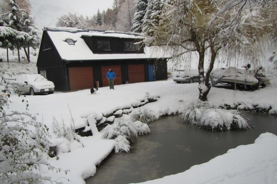 pond and barn in winter, plants are now grown