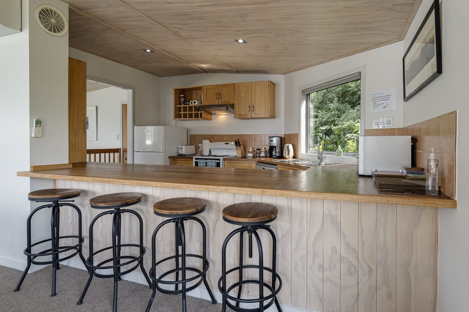 Bar stools along the kitchen bench