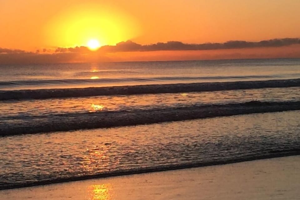 Sunrise over the surf beach