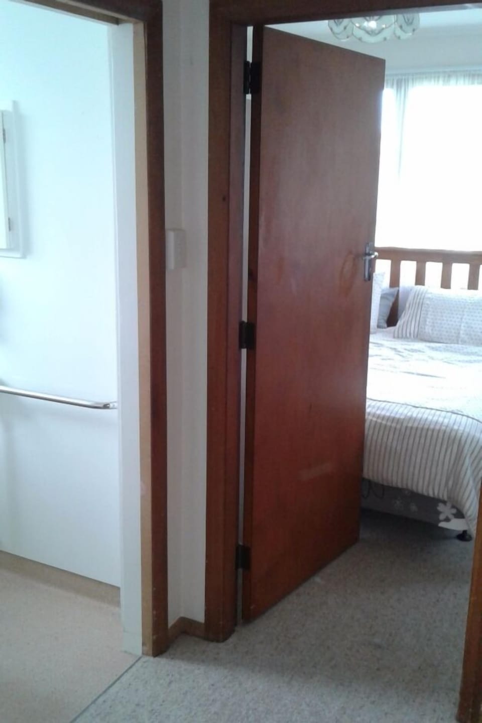 the bathroom is located next to the master bedroom