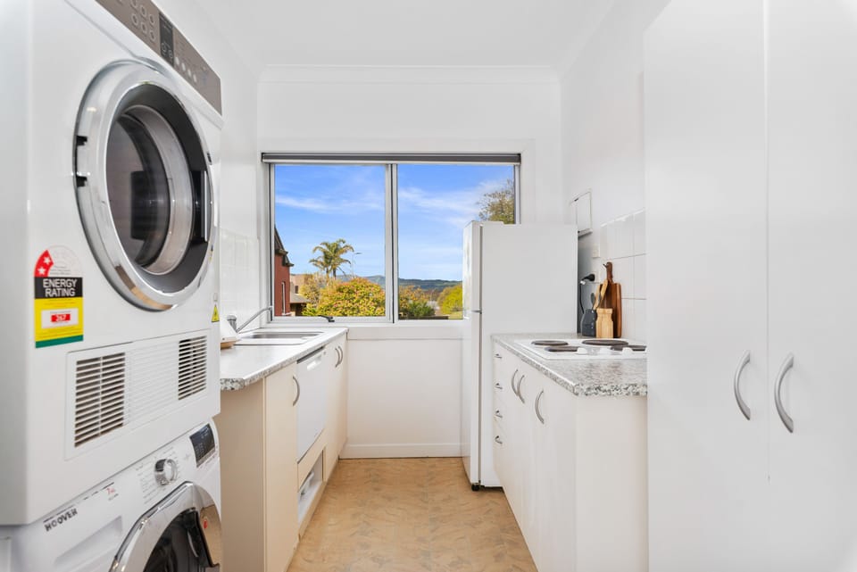 Kitchen with washer, drier and dishwasher