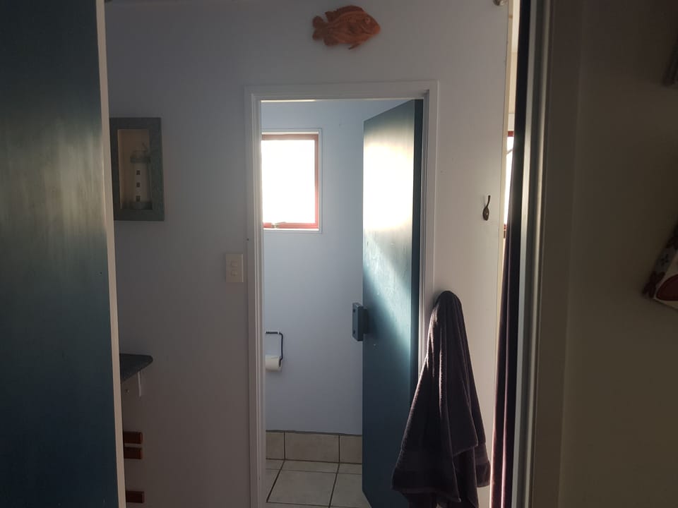 Downstairs bathroom. Basin left, shower right, toilet straight ahead.
