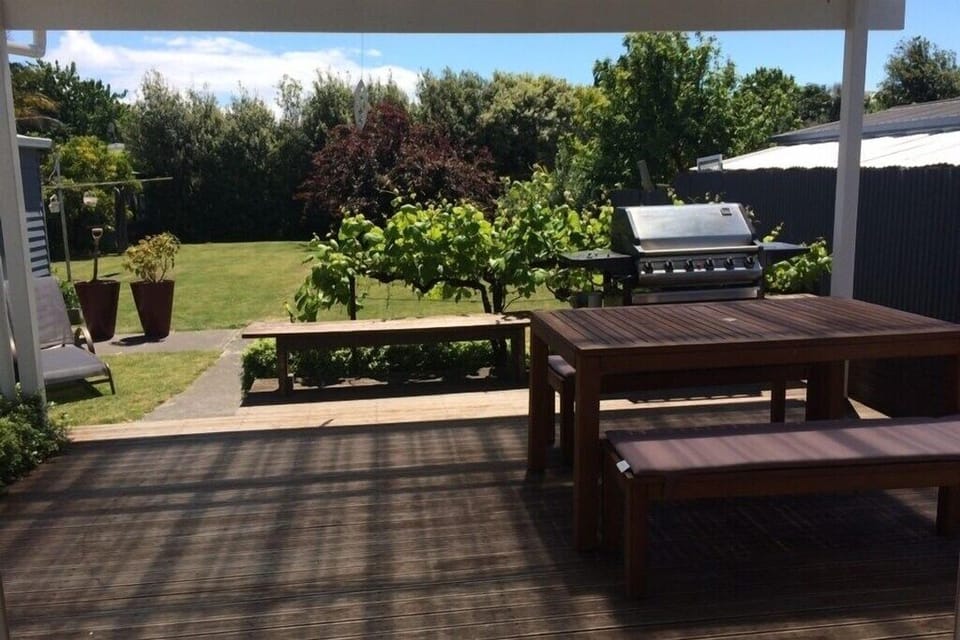 Looking out from the Dinning/|Kitchen to the covered deck and backyard