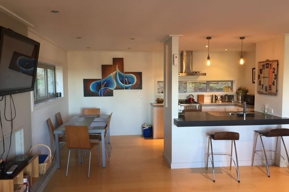 Dining and kitchen with breakfast bar