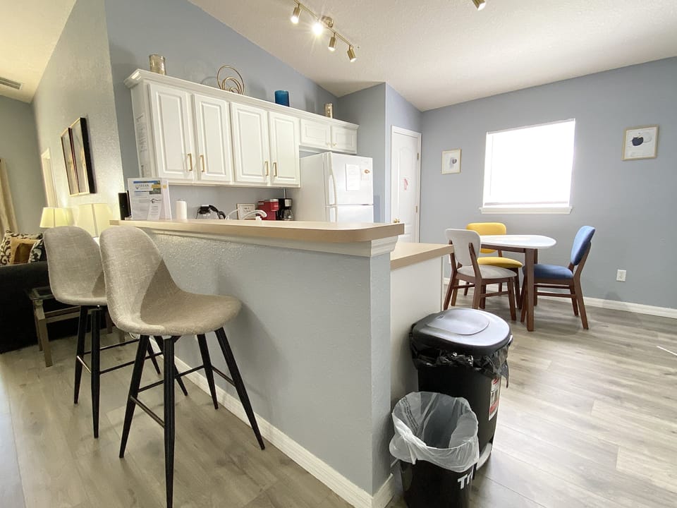 Fully equipped kitchen with ample seating, perfect for enjoying meals together.
