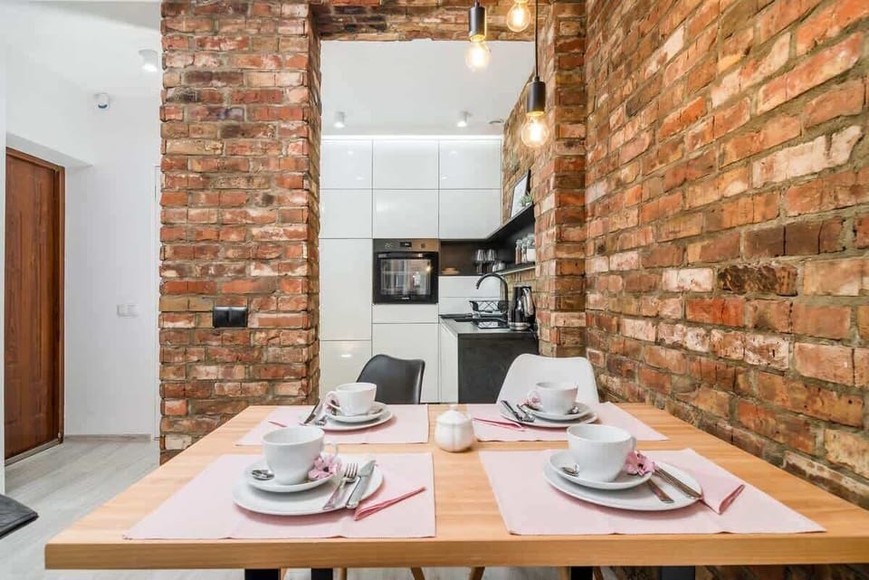 Dining area of Odrzańska 14/9 with dining table and chairs