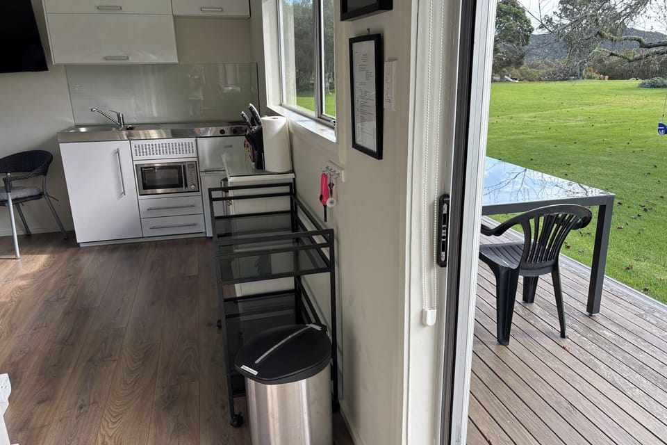 Indoor-outdoor living. Deck extends from living area.