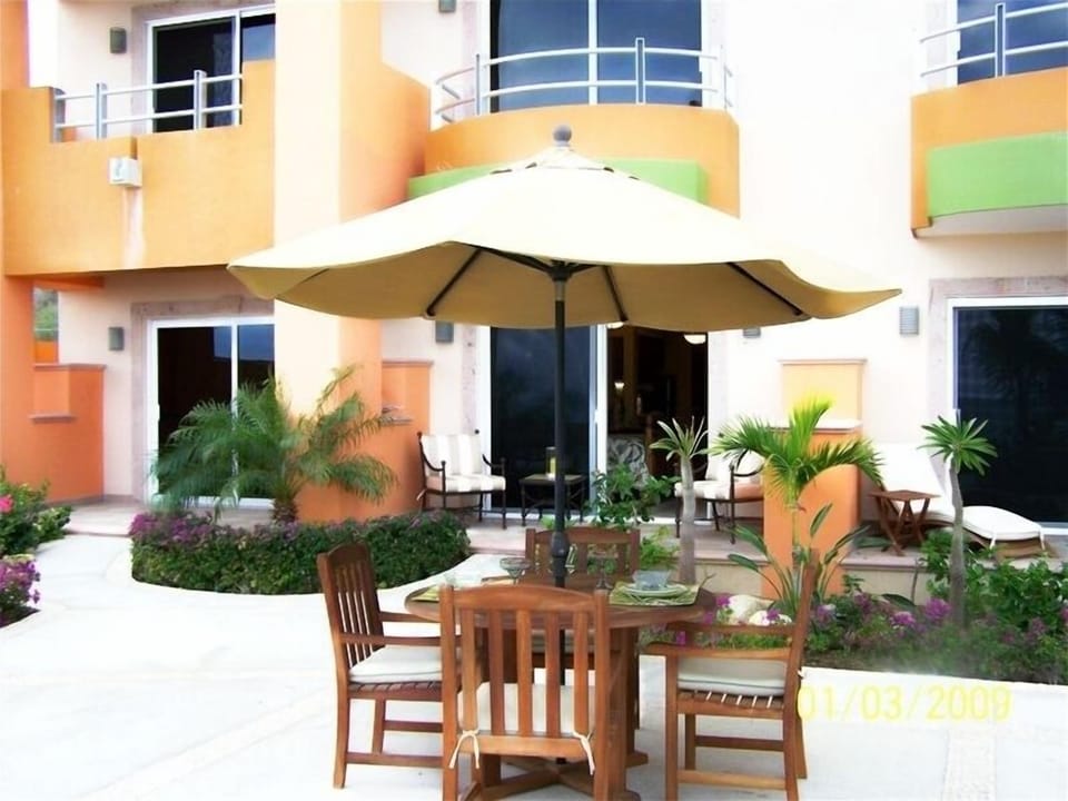 Dining on the pool deck just outside the unit