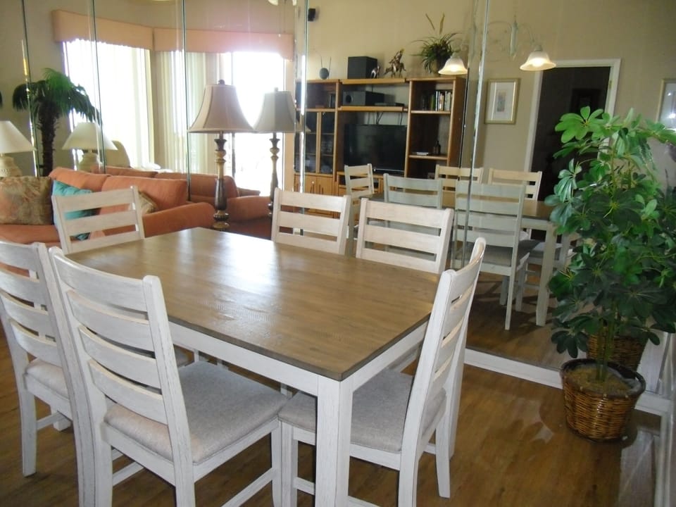 Dining area, mirrored wall reflecting entertainment center