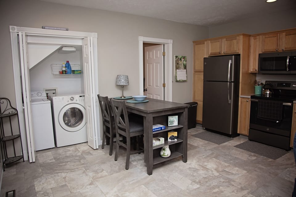Kitchen, laundry, and one of the two downstairs bathrooms