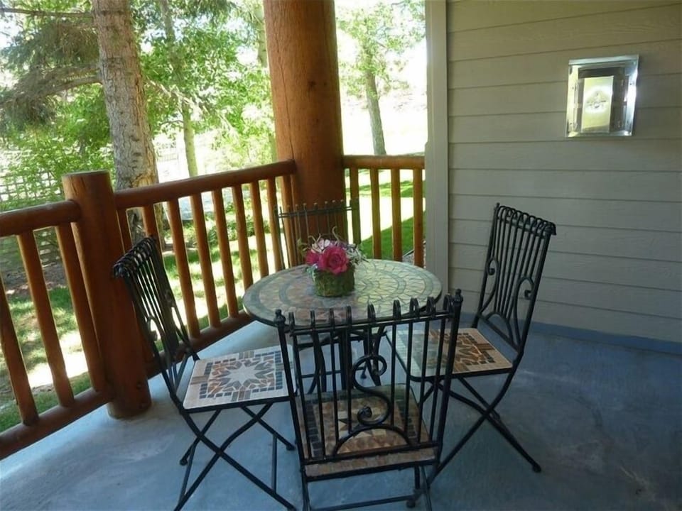 Covered Patio, looking towards ski lift and ski run to right and hot tub ahead.