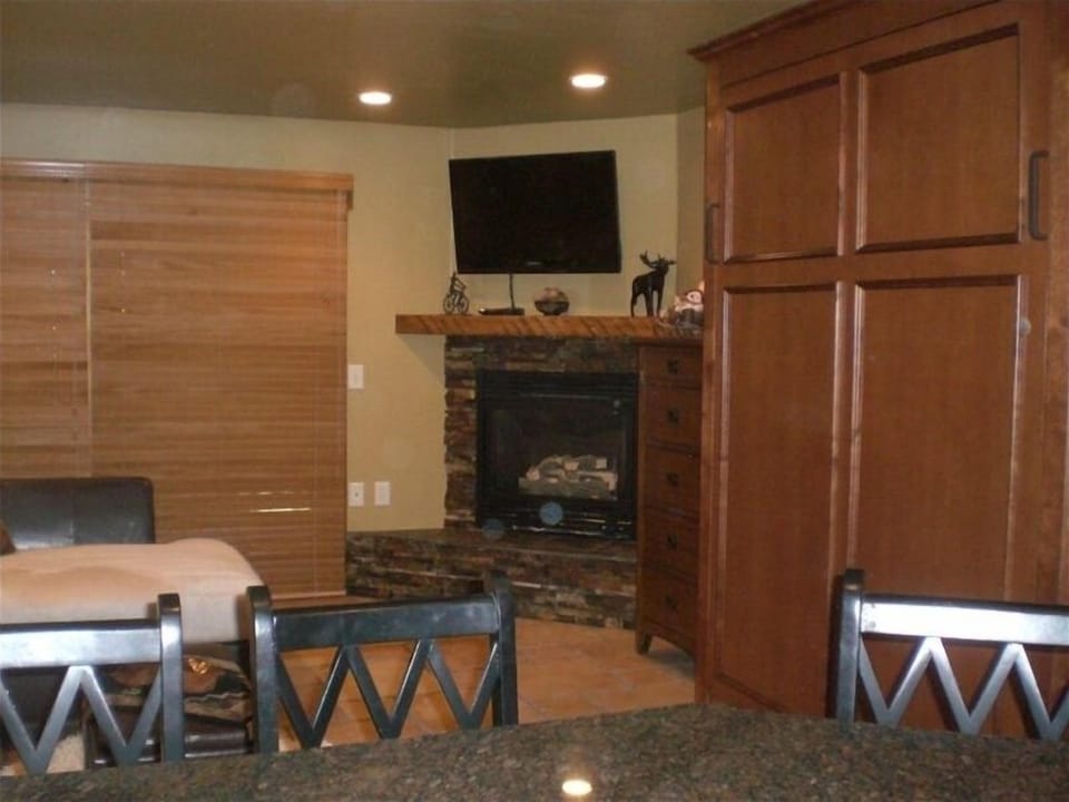  Murphy bed in custom cabinet on right. Gas fireplace with rotating flatsceen 