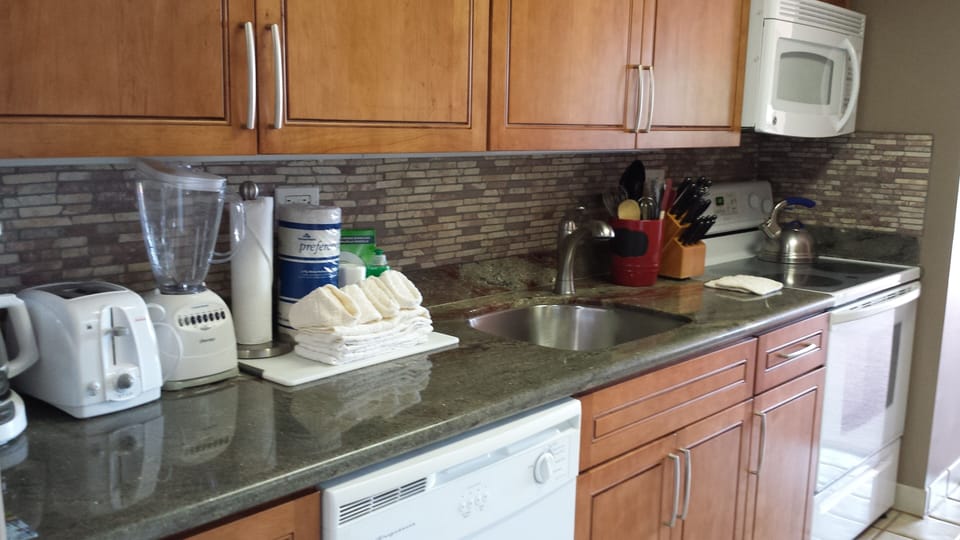 Kitchen with cherry cabinets & granite counter tops