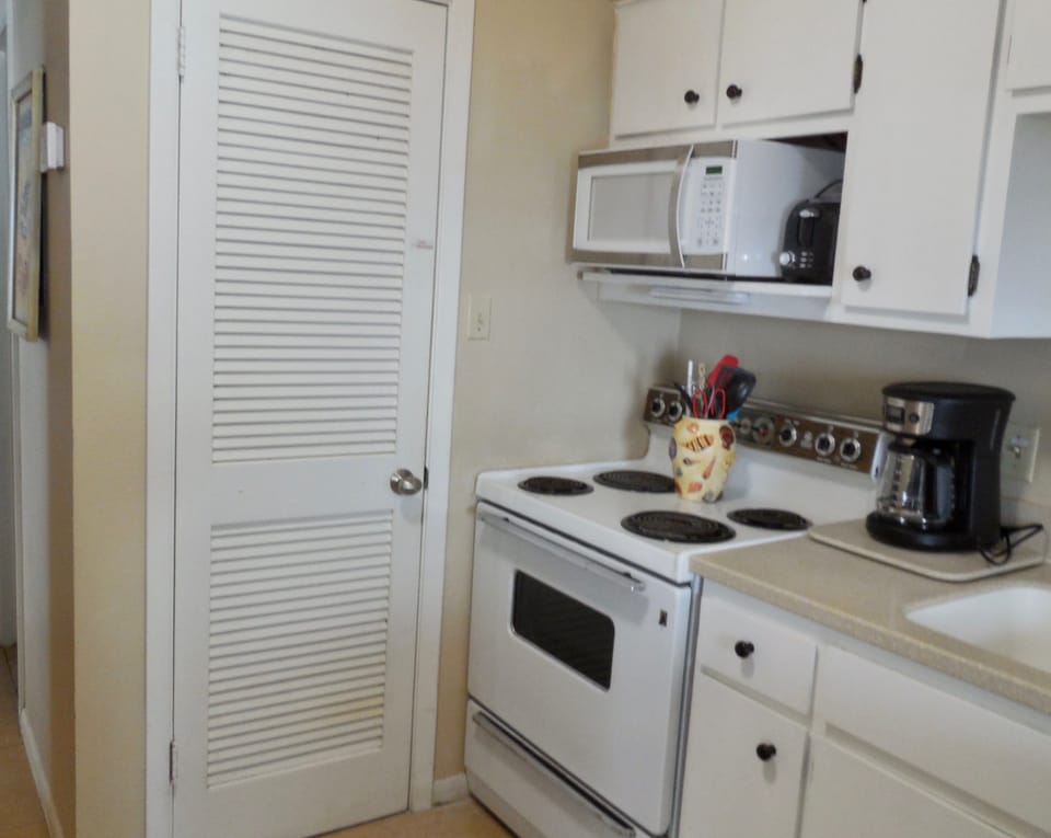 The pantry has plenty of shelf space, plus cleaning supplies