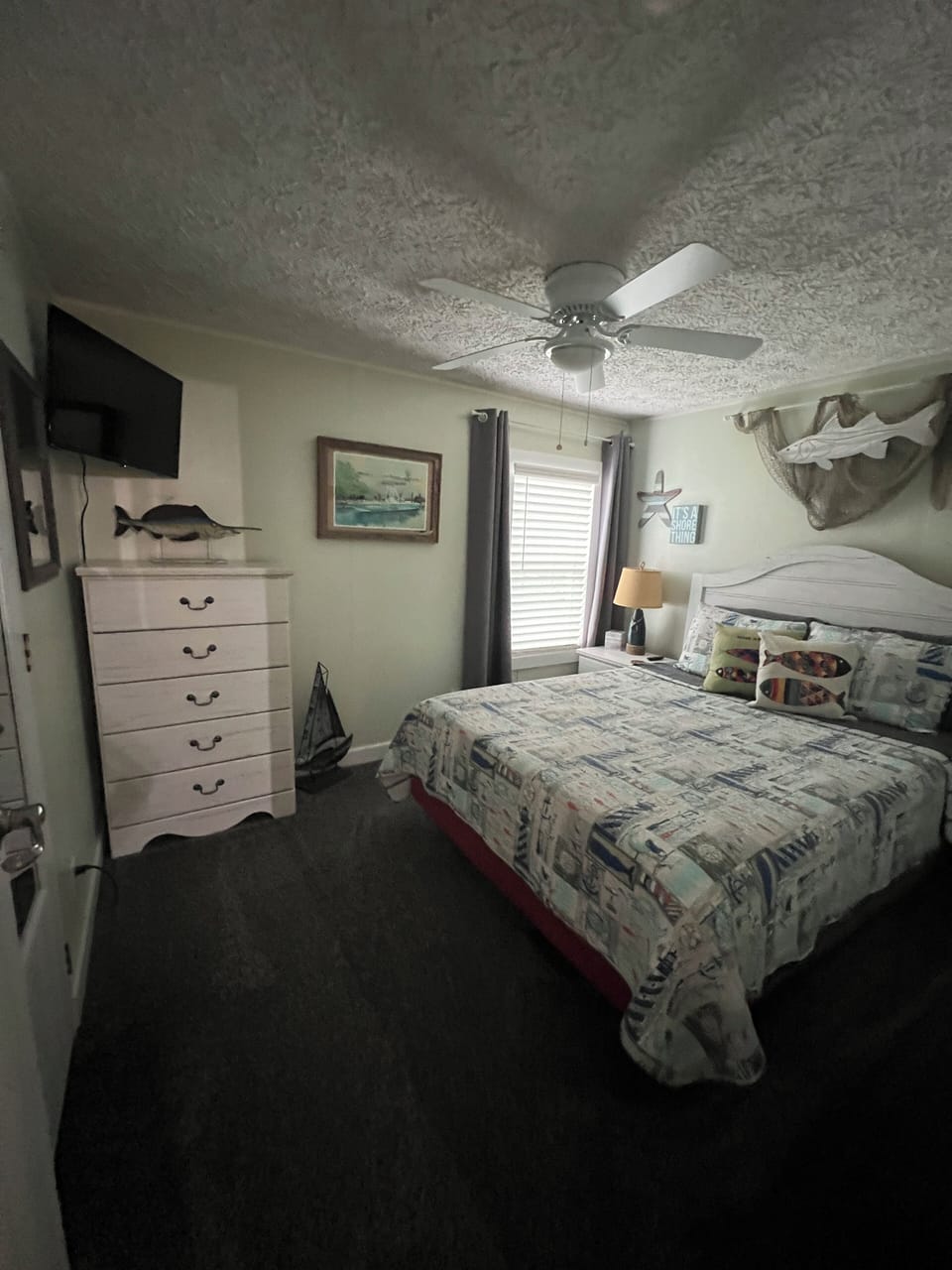 Guest bedroom queen bed. TV