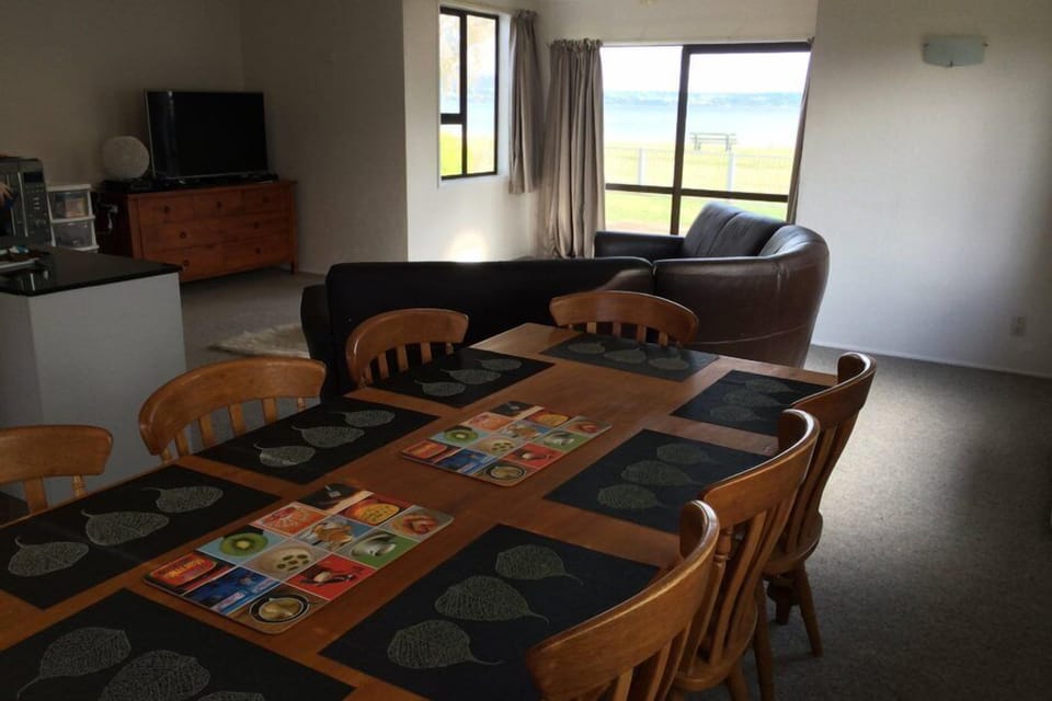 Dining and Sitting room looking out across the deck to the Lake
