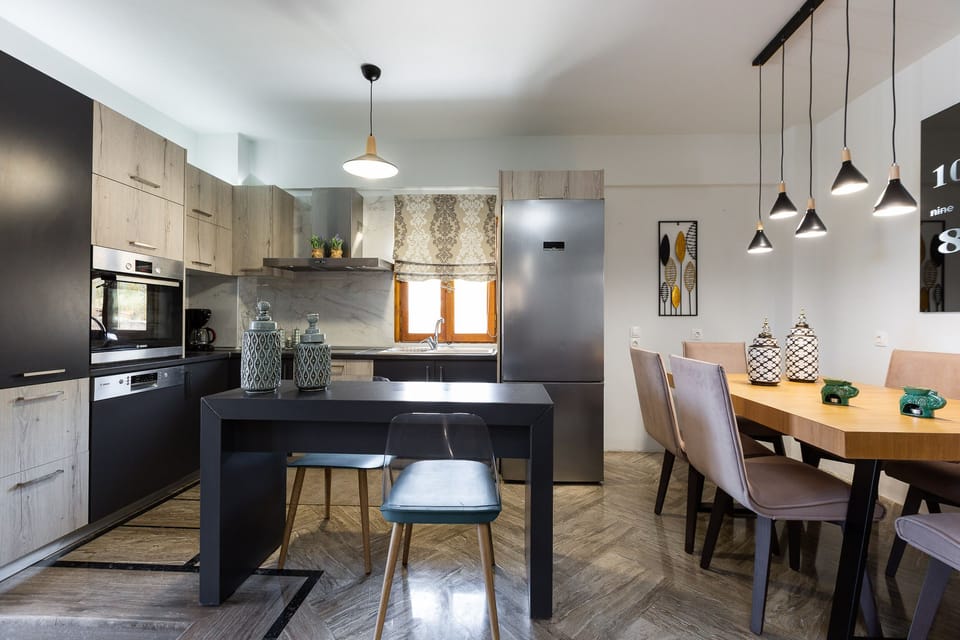 Indoor dining area and breakfast counter by the kitchen.