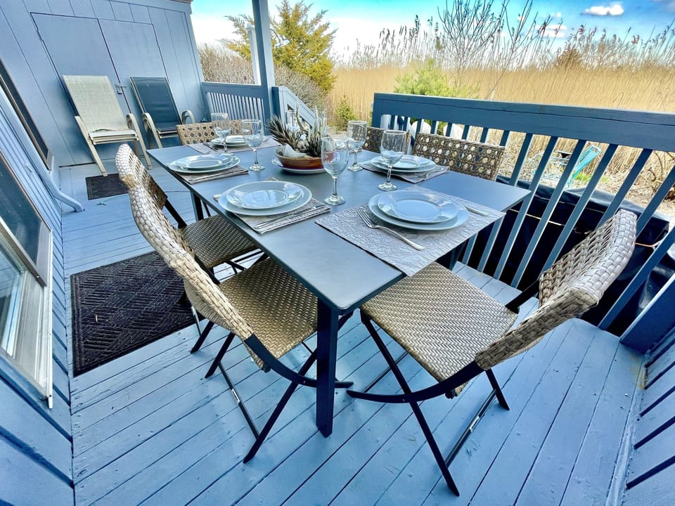Dine on the deck with bluestone table and comfy folding chairs for 6