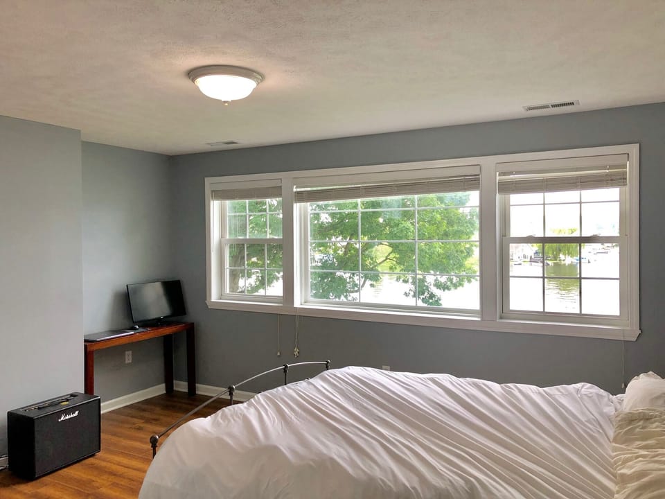 Upstairs lake view room with queen bed